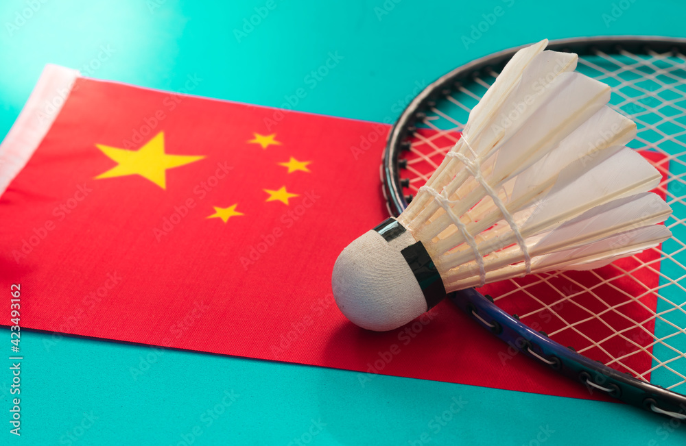 Badminton racket and shuttlecocks on China flag. Stock Photo | Adobe Stock
