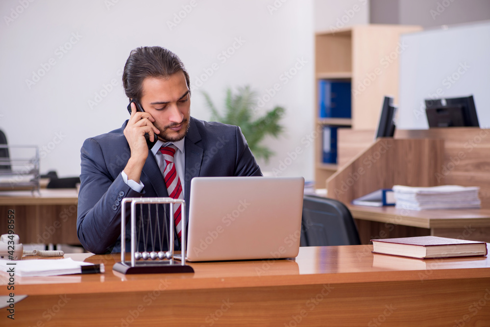 Young man businessman employee sitting in the office Young man businessman employee sitting in the office