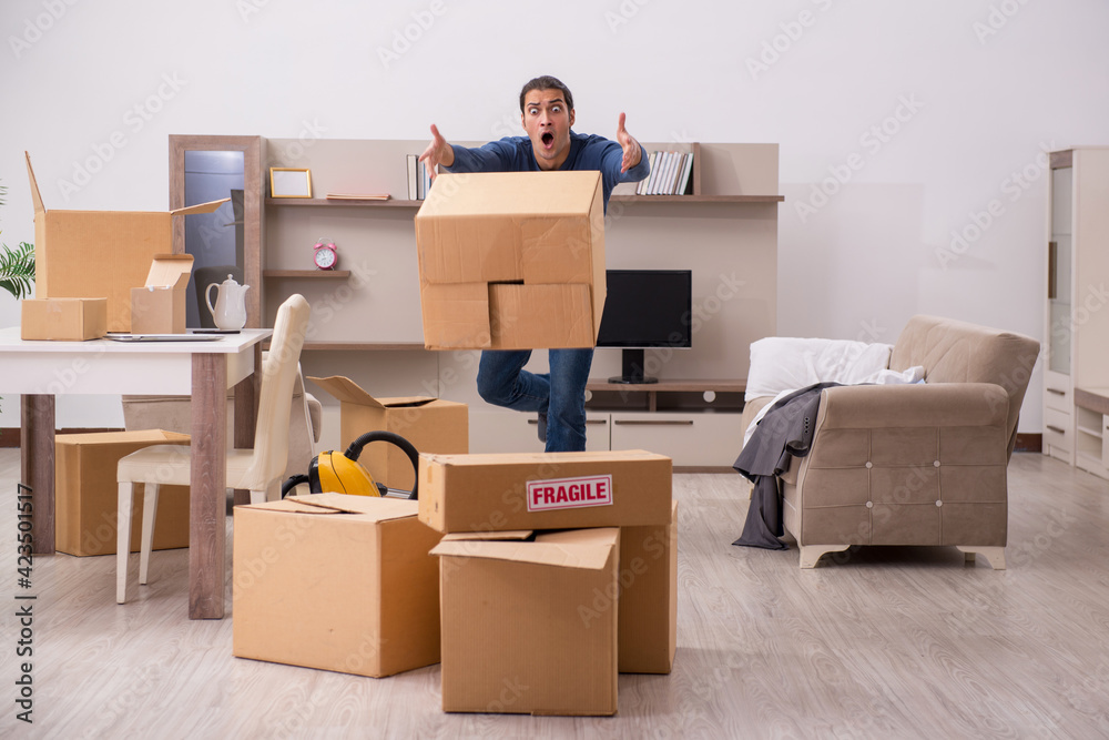 Fototapeta premium Young man moving to new flat