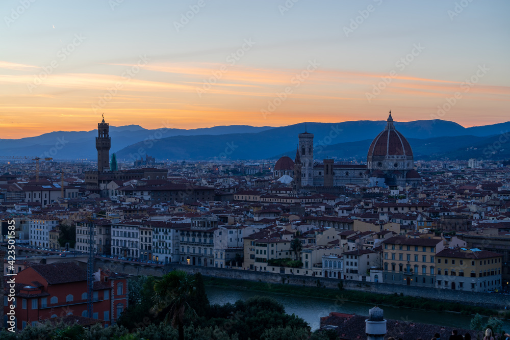 Florence or Firenze sunset aerial cityscape. Panorama view from Michelangelo park square. Ponte Vecchio bridge, Palazzo Vecchio and Duomo Cathedral. Tuscany, Italy