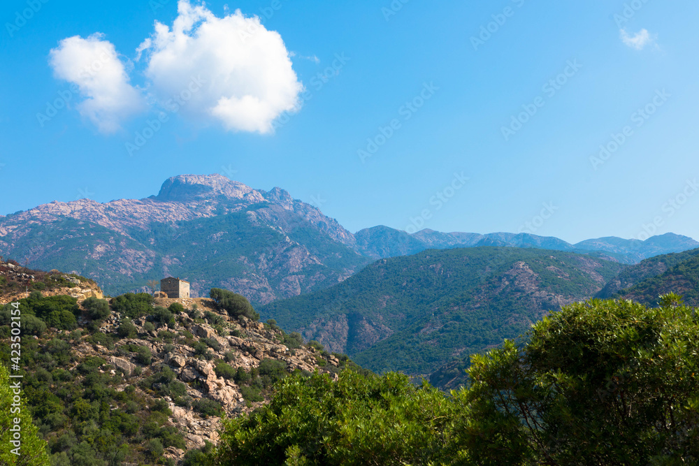 Abandoned house on the hill. Mountain view as a background. Near the capital city, Ajaccio, Bavella mountains,  Corsica