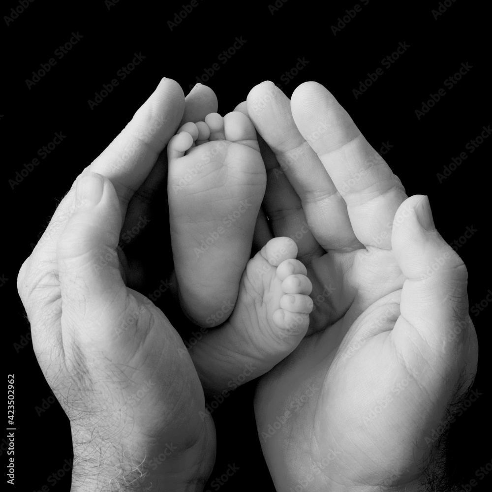 Fototapeta premium Together - mother, father and child holding hands