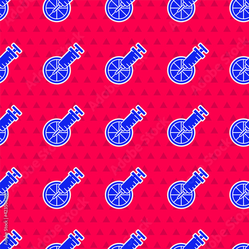 Blue Genetically modified citrus fruit icon isolated seamless pattern on red background. Orange in a cut. Healthy lifestyle. GMO fruit. Vector