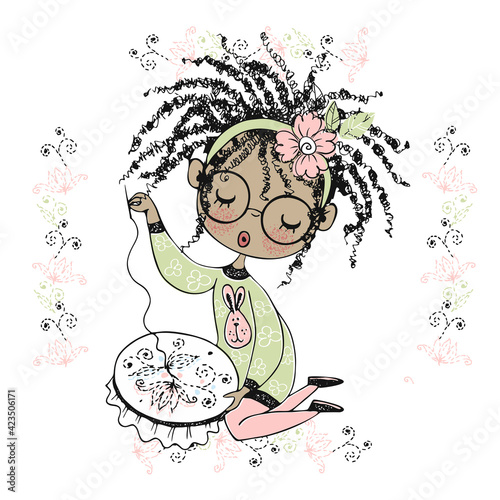 A pretty black girl is engaged in needlework and embroiders a beautiful pattern on the hoop. Vector