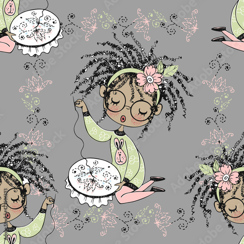 Seamless pattern with a cute little black girl needlewoman embroidering on an embroidery frame. Vector.