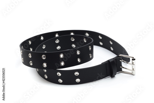 black belt with rivets and buckle rock theme isolated on white background . photo