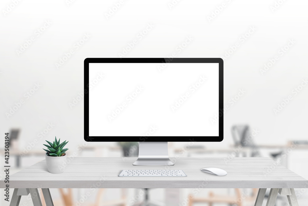 Fototapeta premium Modern computer display with isolated screen for mockup, app or web page presentation Clean desk with plant, keyboard and mouse