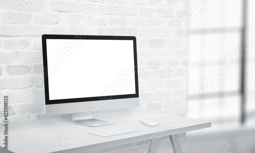 Coputer display on office desk with isolated screen in white for app or web page presentation mockup