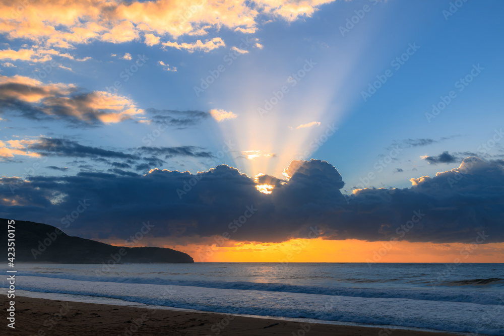 Sunrise seascape with clouds and sun rays Sunrise seascape with clouds and sun rays