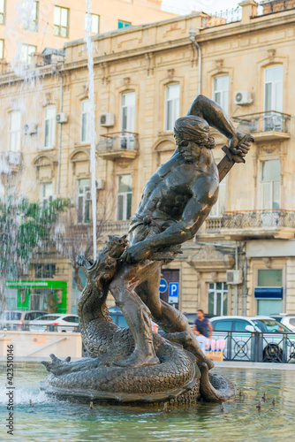 Baku, Azerbaijan - June 23, 2018: Fountain battle with a serpent in the center of Baku, Azerbaijan © kosmos111
