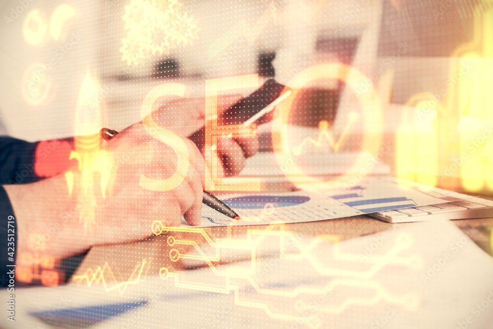 Multi exposure of man's hands holding and using a digital device and seo drawing. search optimization concept. Multi exposure of man's hands holding and using a digital device and seo drawing. search optimization concept.