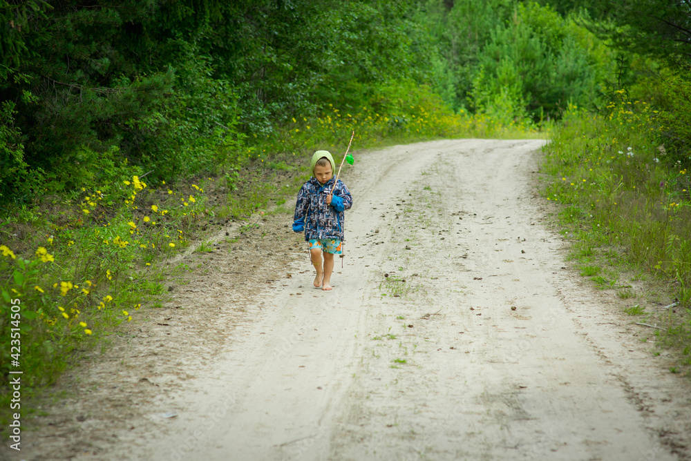 a child walks in a mushroom forest. selective focus a child walks in a mushroom forest. selective focus