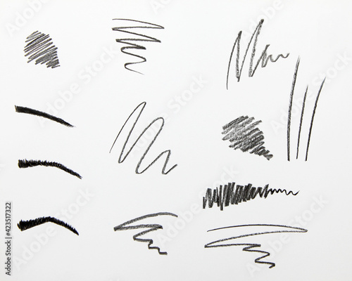 Cosmetic pencil samples isolated on a white background