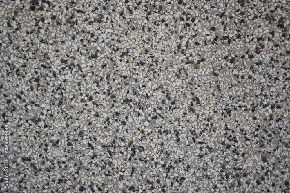 Rough textured wall made from black and white pebbles, abstract background, wall pattern, grunge rock backdrop Rough textured wall made from black and white pebbles, abstract background, wall pattern, grunge rock backdrop