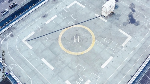 Tableau sur toile Aerial drone view of helipad on the roof of a skyscraper iin downtown with citys