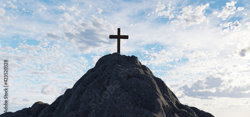 Cross on mountain peak at sunset christian religion
