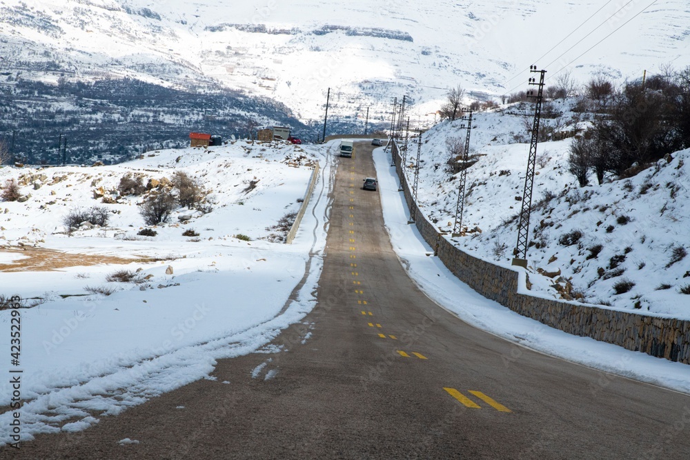 asphalt road in the Lebanon mountains during snow covered winter