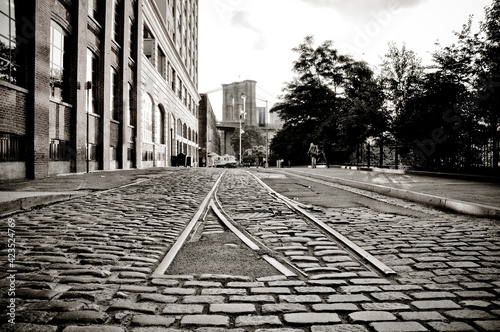beginning of a rail track in an old street in the city