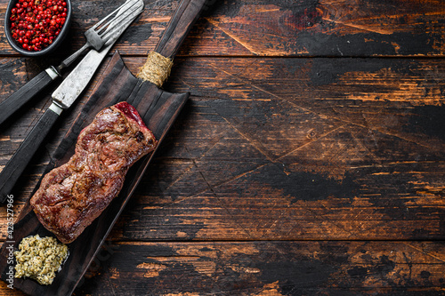 Grilled rump marble black angus beef steak. Wooden background. Top view. Copy space