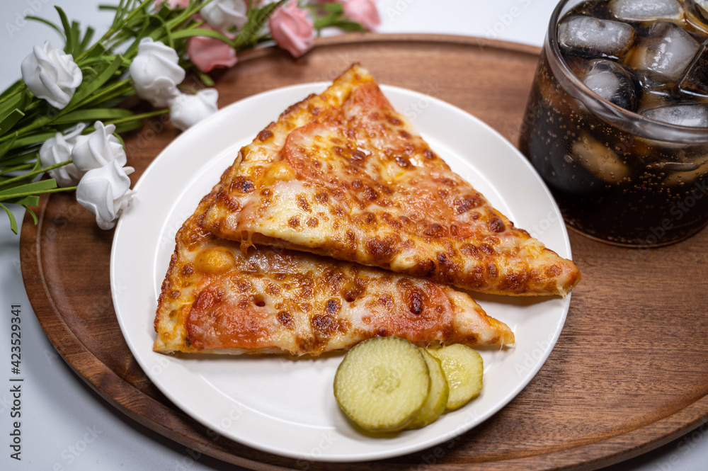 Thinly sliced pepperoni is a popular pizza Thinly sliced pepperoni is a popular pizza