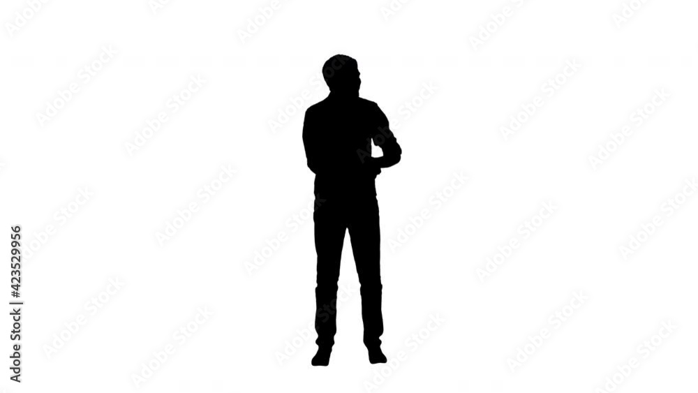 Silhouette Young man waiting for his friends, according to the time on his phone they are late, they finally come and hug him Silhouette Young man waiting for his friends, according to the time on his phone they are late, they finally come and hug him