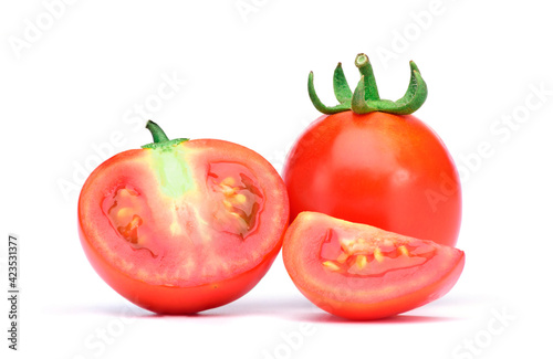 Fresh red tomatoes, whole and also sliced Isolated on white background