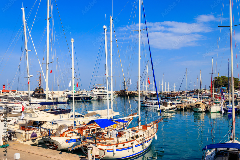 White yachts in the sea harbor of Kemer, Antalya province in Turkey. Kemer Marina on the Mediterranean sea White yachts in the sea harbor of Kemer, Antalya province in Turkey. Kemer Marina on the Mediterranean sea