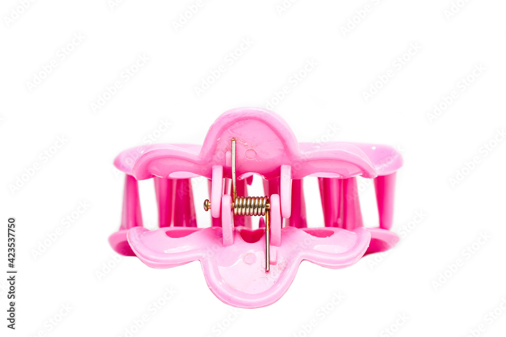 Pink colored hair clip isolated on white background. Pink colored hair clip isolated on white background.
