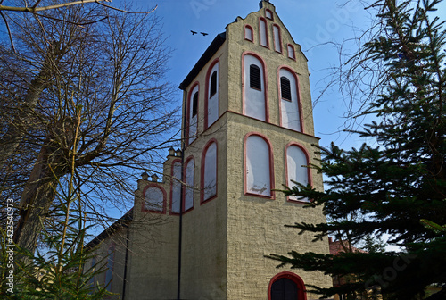 Fototapeta Naklejka Na Ścianę i Meble -  built at the end of the 15th century, a gothic Catholic church dedicated to Our Lady, Queen of Poland in the town of Miłki in Masuria, Poland