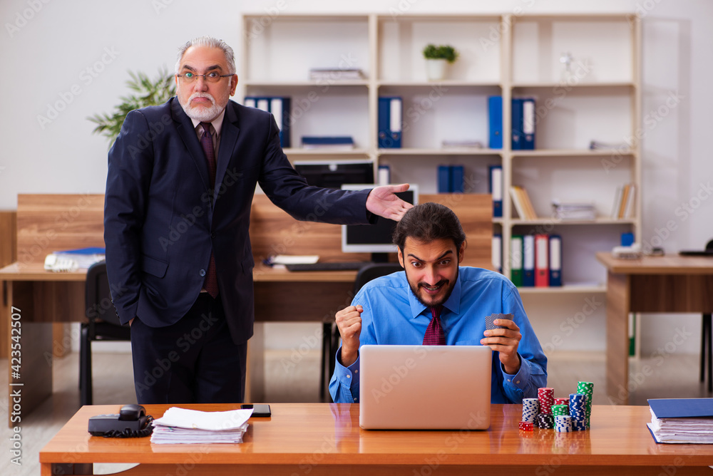 Two male employees in gambling concept