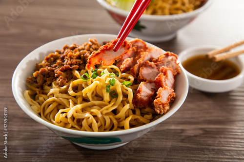 Kolo Mee is a Sarawak Malaysian dish of dry noodles tossed in a savoury pork and shallot mixture, topped off with fragrant fried onions.