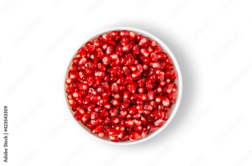 Pomegranate. Ripe berries in a white plate. Isolated on white Pomegranate. Ripe berries in a white plate. Isolated on white