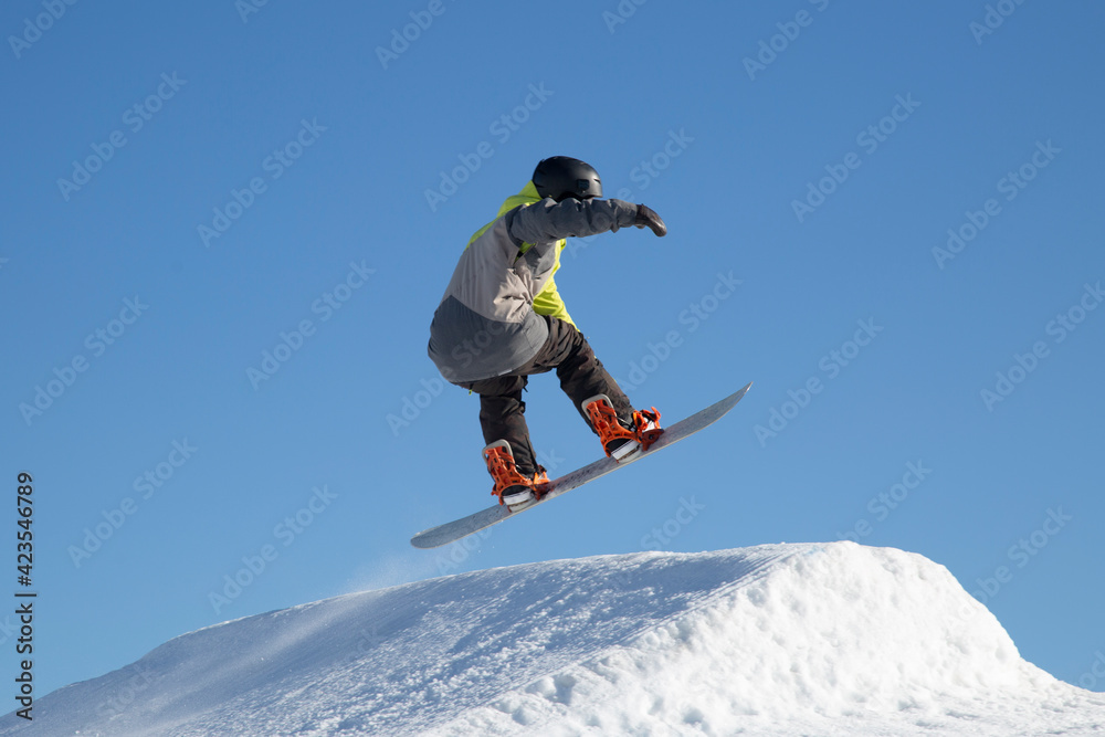 A snowboarder on a snowboard. Extreme winter sports.Rest in winter.