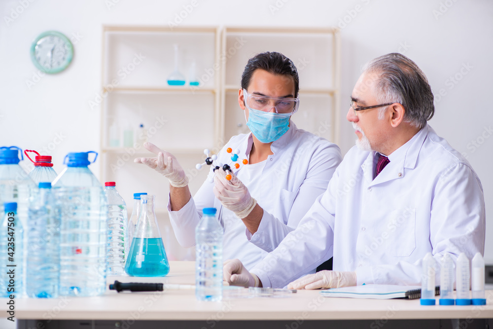 Two chemists working in the lab Two chemists working in the lab