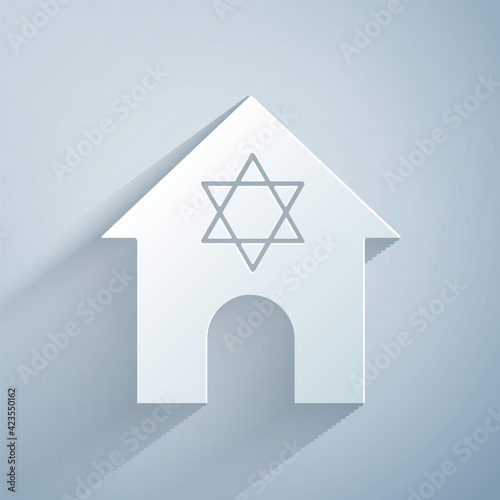 Paper cut Jewish synagogue building or jewish temple icon isolated on grey background. Hebrew or judaism construction with David star. Paper art style. Vector
