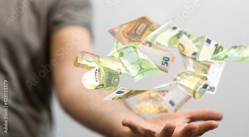 banking euro banknote in hand rain