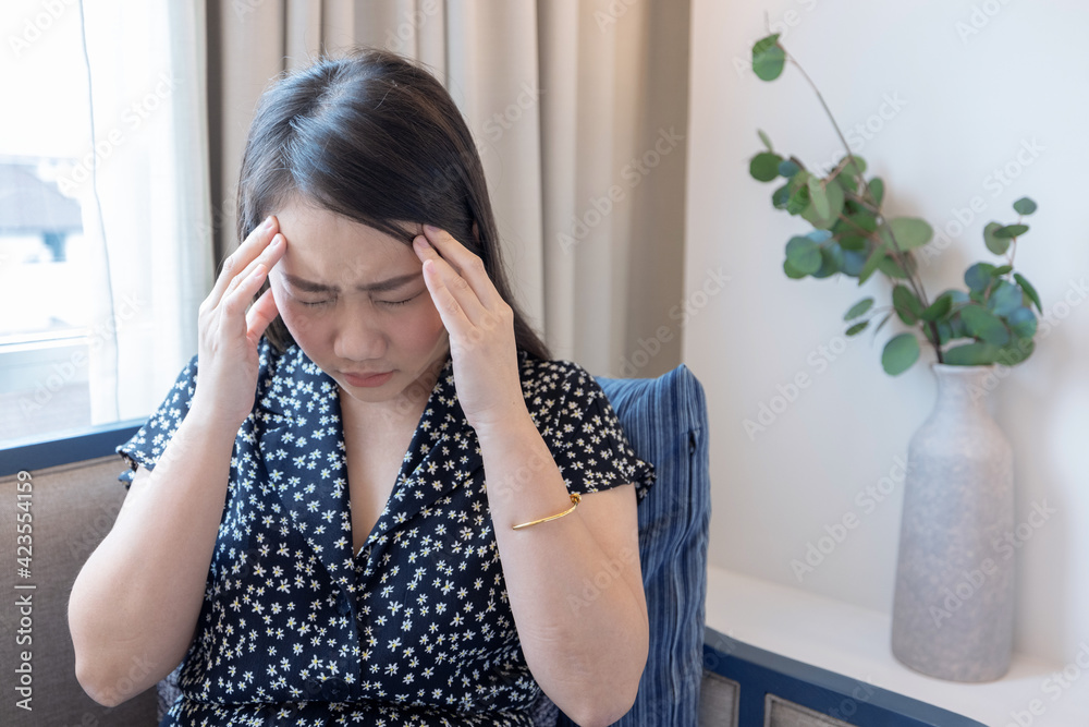 Asian woman suffering from severe headache, Migraine. Asian woman suffering from severe headache, Migraine.