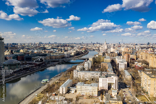 panoramic view from drone on cityscape with river and bridges 
