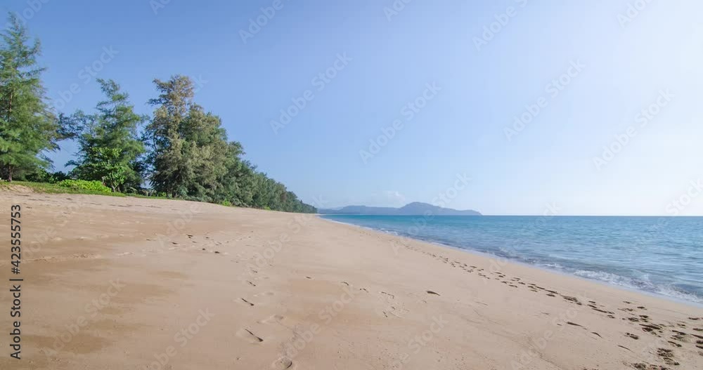 Timelapse summer video 4k of the beach with beach tree in sunshine daytime with white sand beach, peaceful sea and clear blue sky Timelapse summer video 4k of the beach with beach tree in sunshine daytime with white sand beach, peaceful sea and clear blue sky