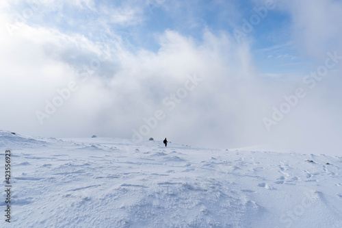 Man walking alone on a snowy mountain