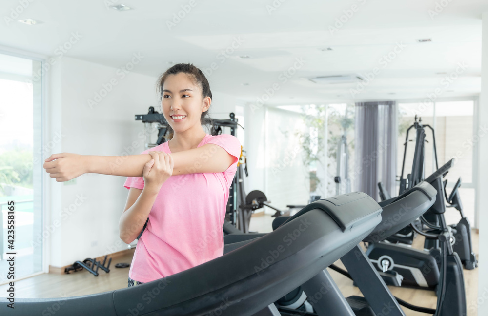 Asian women are exercising in the gym to sift through the leather water, keeping their body healthy. Premium Photo Asian women are exercising in the gym to sift through the leather water, keeping their body healthy. Premium Photo