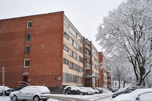 Ols red brick apartment building in winter