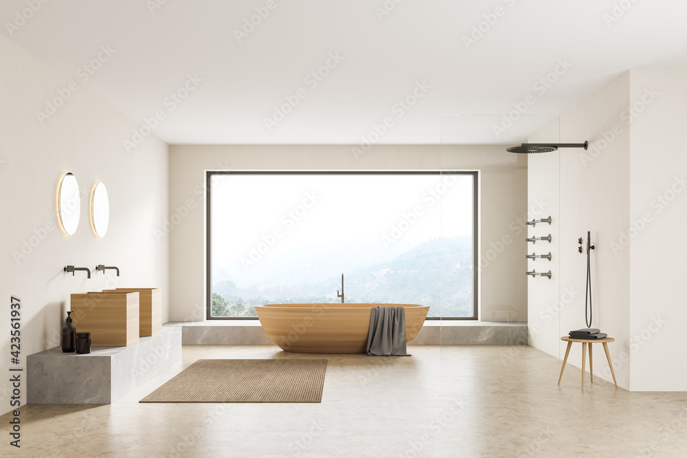 Bathtub and sinks with shower in beige bathroom with window Bathtub and sinks with shower in beige bathroom with window