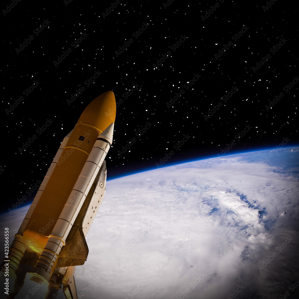 Rocket above earth. The elements of this image furnished by NASA. Rocket above earth. The elements of this image furnished by NASA.