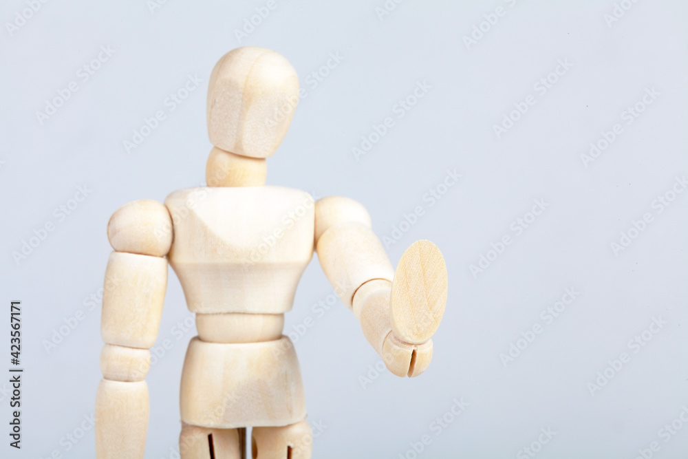 Wooden figurine, man doing a Wooden figurine, man doing a