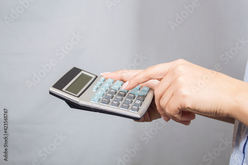 girl holding a calculator