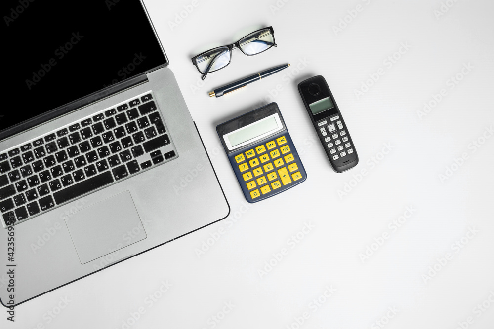 modern and outdated gadgets for daily use on a white floor, top view modern and outdated gadgets for daily use on a white floor, top view