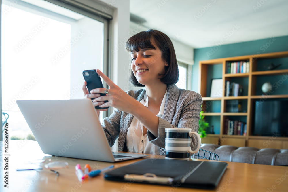 Young woman working at home. Home office. Young woman working at home. Home office.