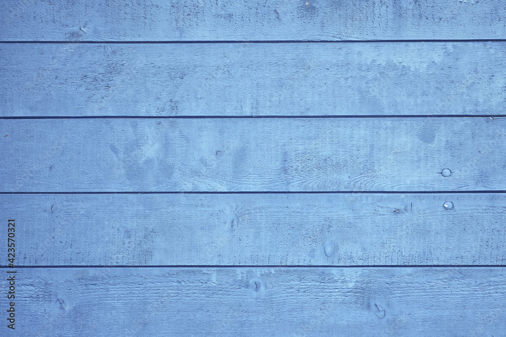 Naklejka premium Wooden background with blue colored planks