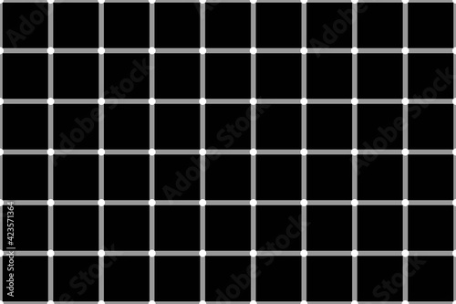 Grid made of grey lines with whites dots at their intersections. The dots are flashing on black background creating an optical Illusion.